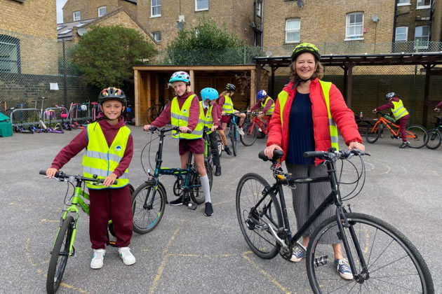 Fleur Anderson with Year 6 pupils in the playground